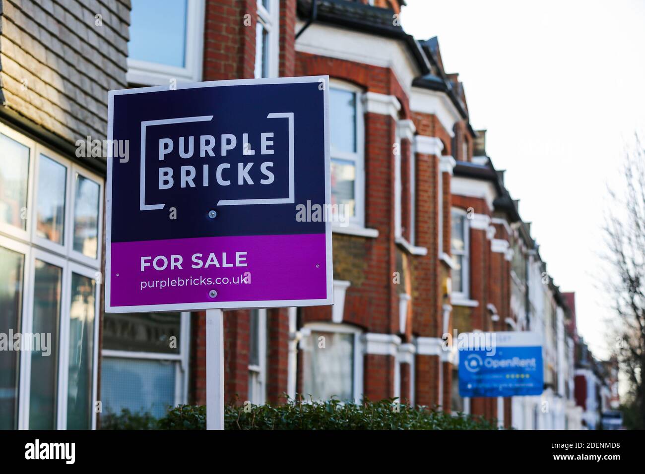 A Purple Bricks' ÔFor Sale' board sign erected outside a property in