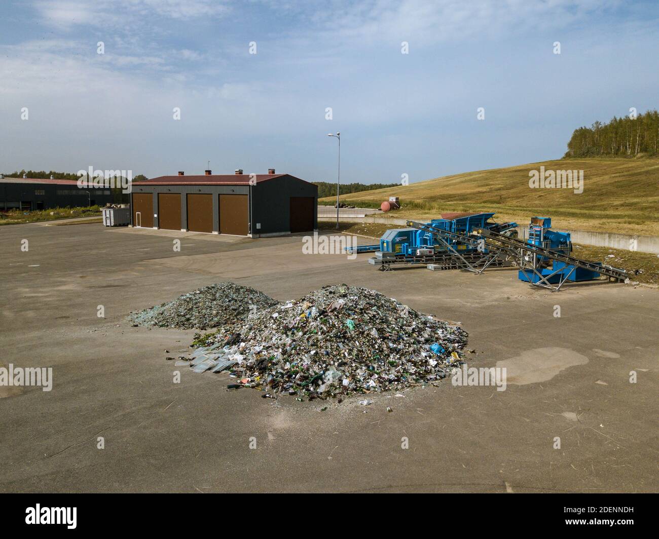 Heaps of glass garbage. A lot of broken bottles. Industrial waste