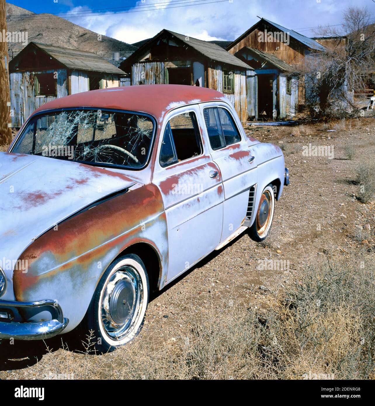 Old very rusty Renault Dauphine in a ghost town Stock Photo