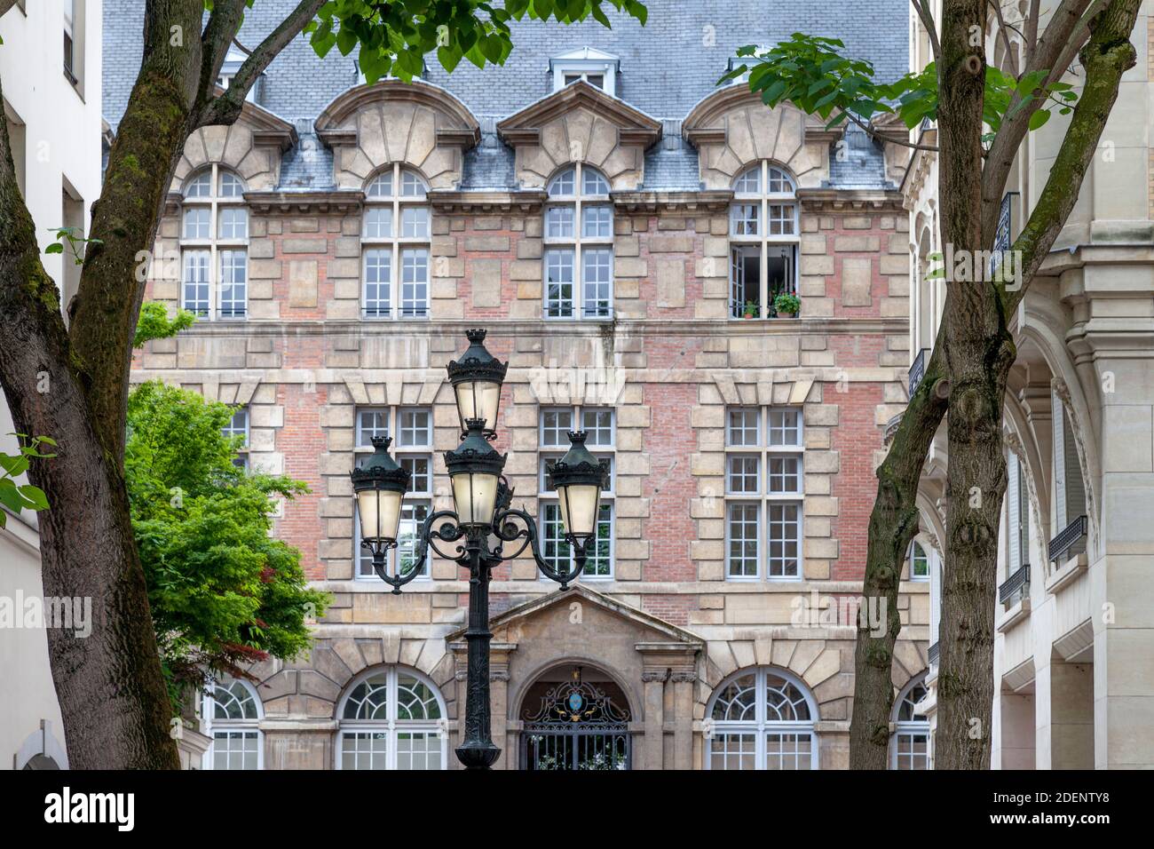 Lamppost in Place de Furstenberg with Institut d’Études Augustiniennes (founded 1867) beyond, Paris, France Stock Photo