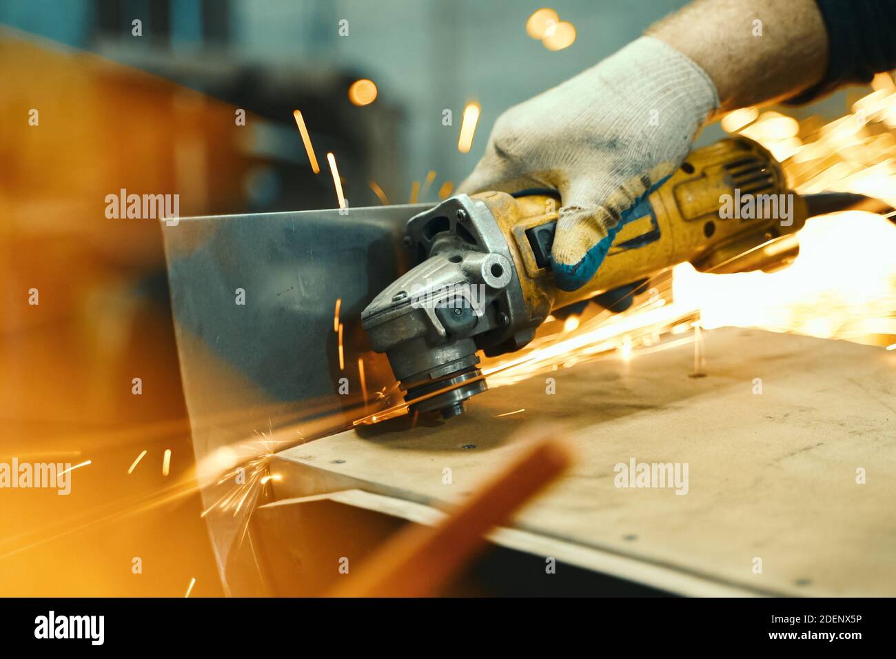 Metal processing with angle grinder. Sparks in metalworking Stock Photo