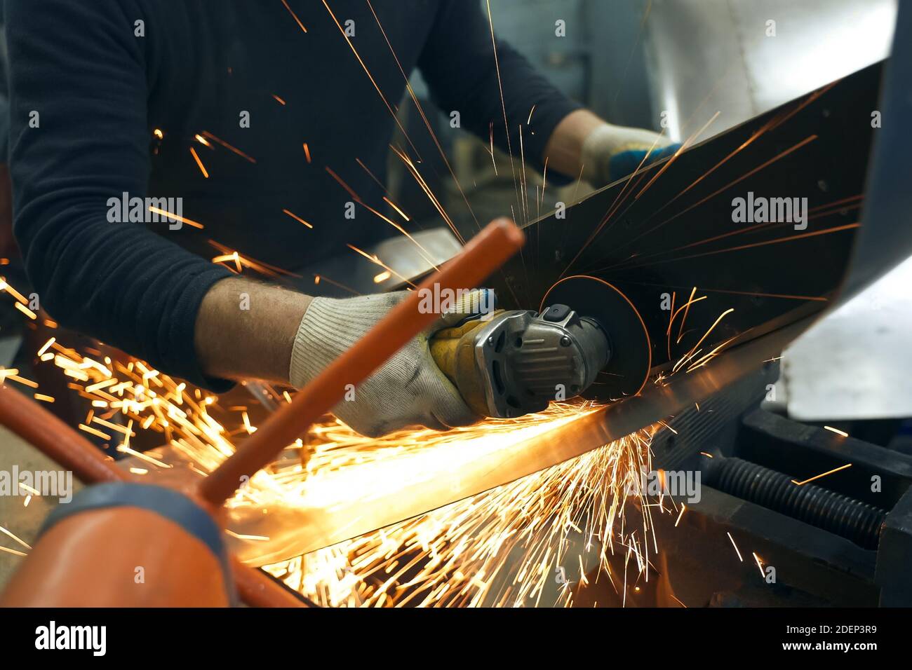 Metal processing with angle grinder. Sparks in metalworking Stock Photo