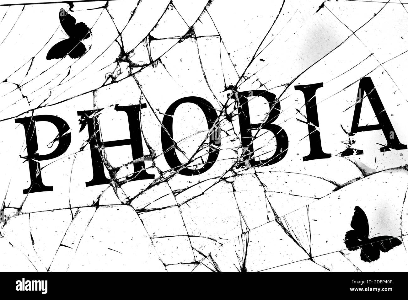 broken glass with cracks with the inscription phobia Stock Photo Alamy