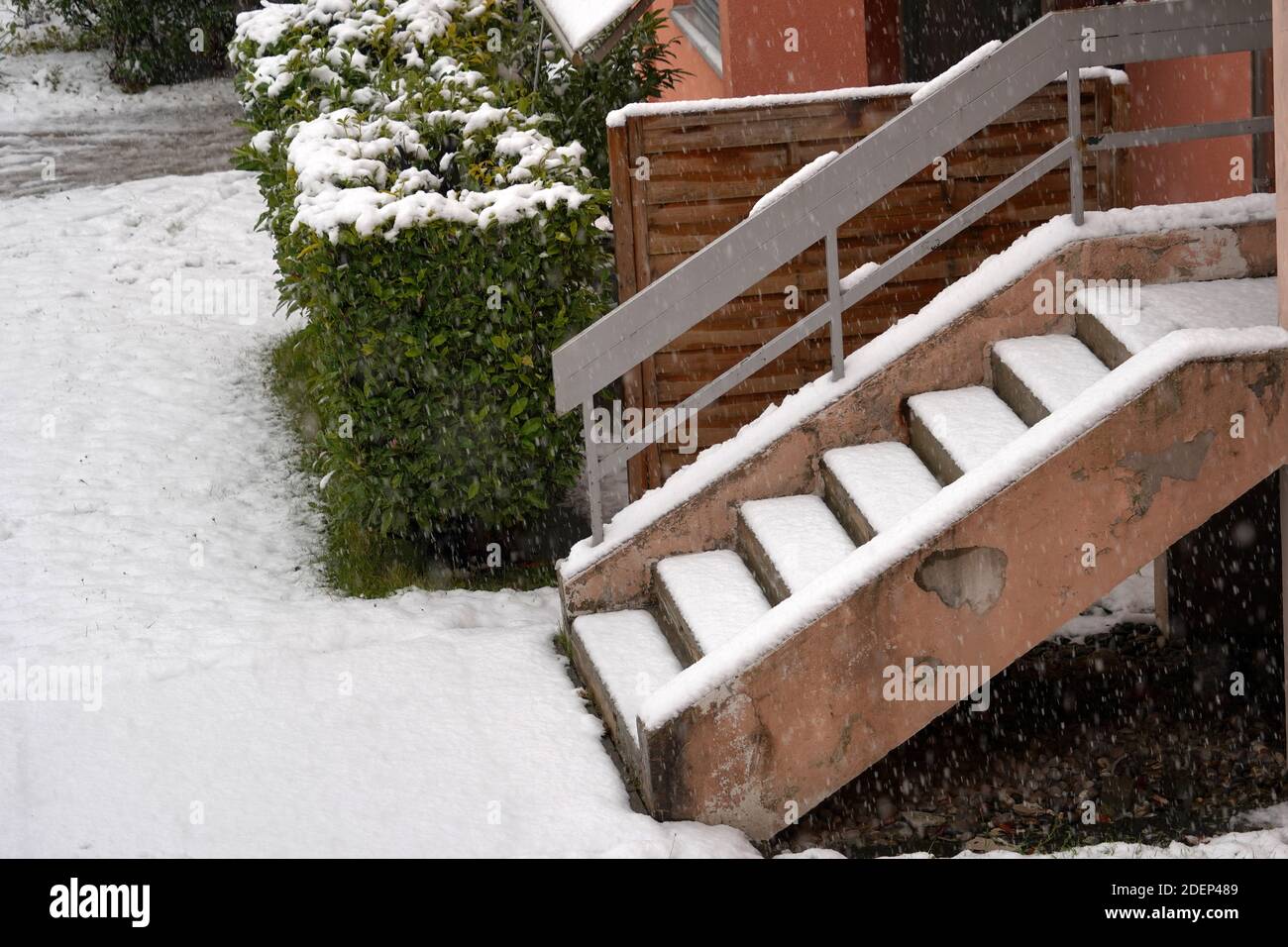 Outdoor stairs of a residential building covered with a layer of fresh