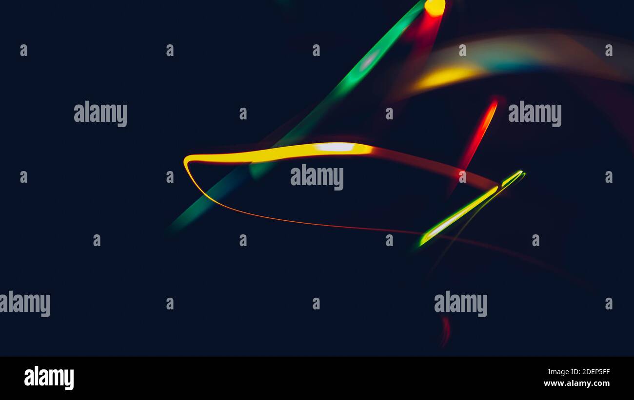 Abstract background on a black background.colorful,wavy colored lines ...