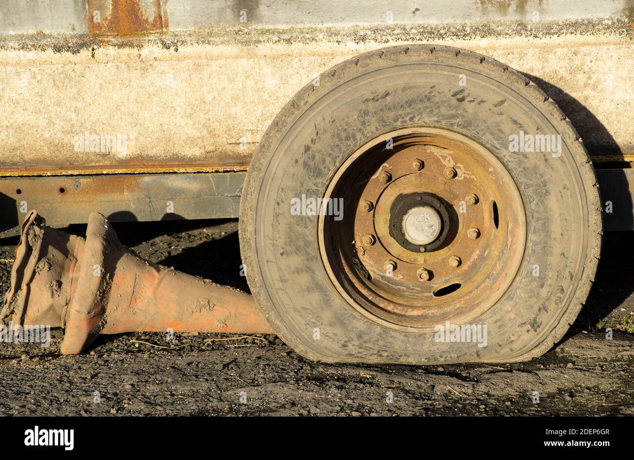 Old flat truck tyre Stock Photo