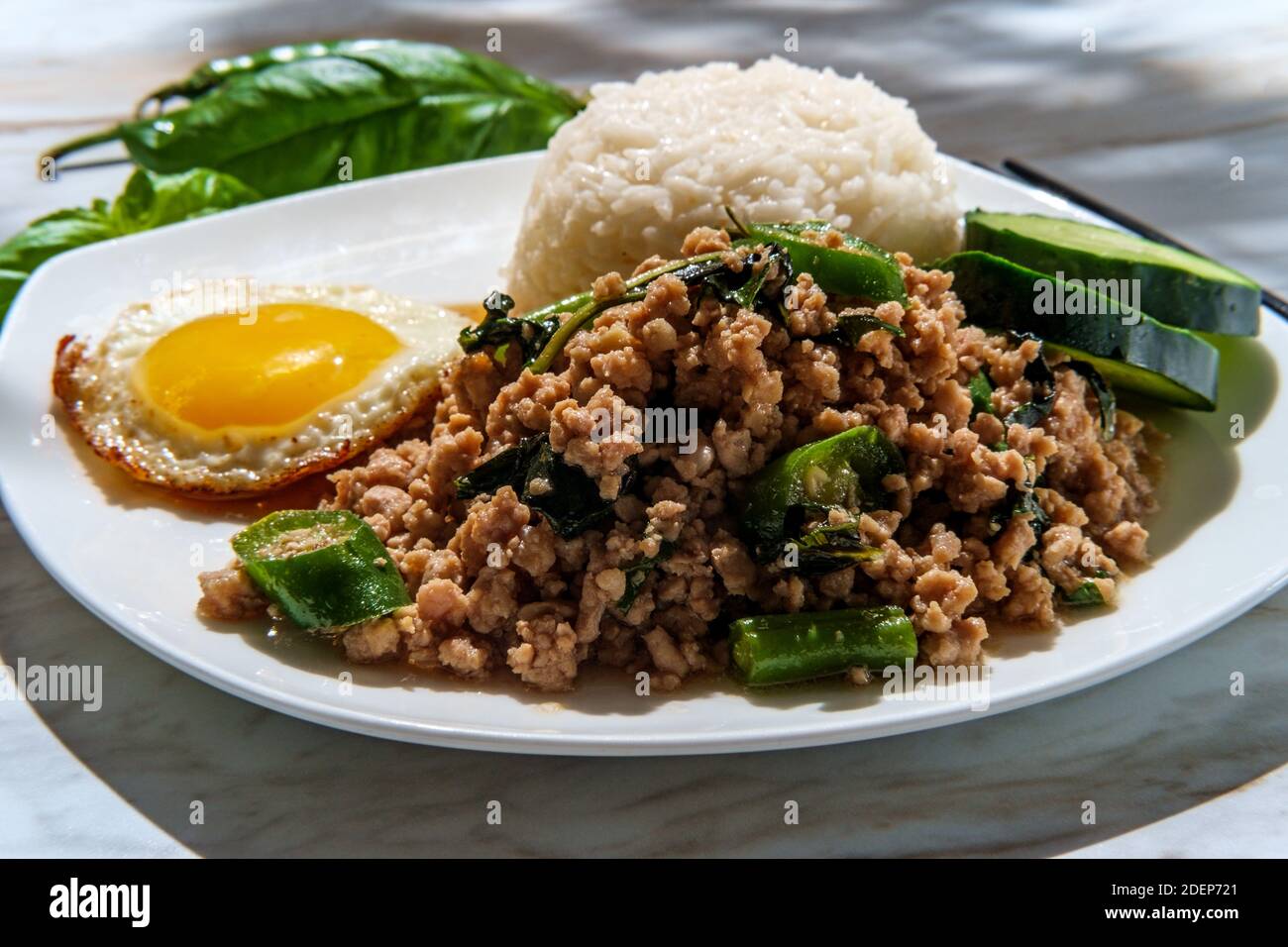 Krapow Fried Rice Phat Krapow Mu Sap also known as stir-fried Thai basil pork with oyster ...