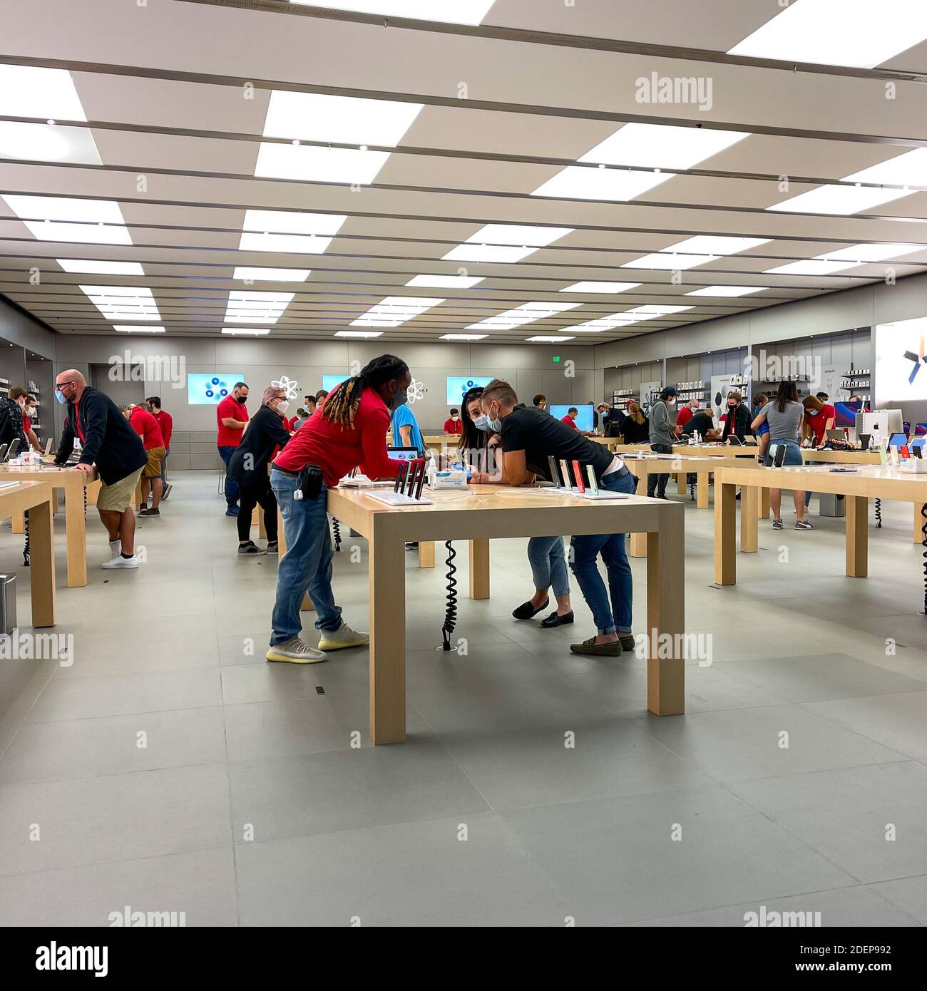 Salespeople and Customers at an Apple Store Looking at the Latest Apple  Products for Sale Editorial Stock Photo - Image of american, international:  203627338