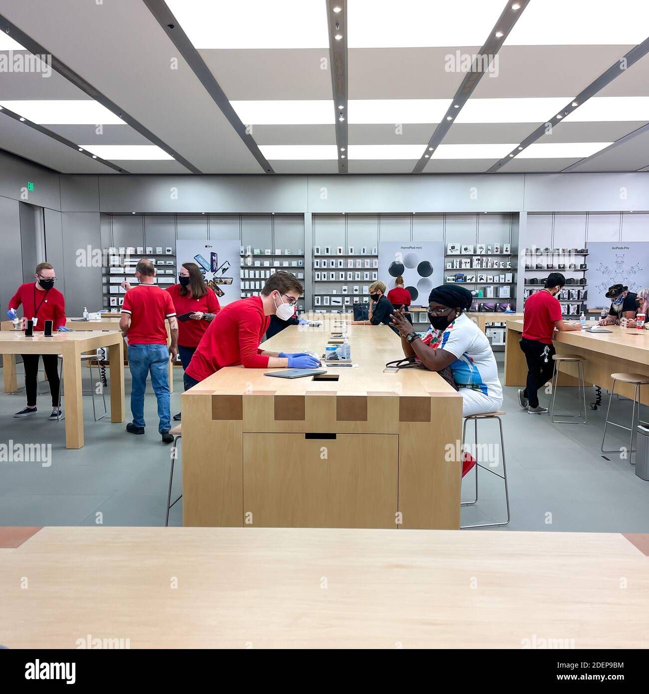 Salespeople and Customers at an Apple Store Looking at the Latest Apple  Products for Sale Editorial Stock Photo - Image of american, international:  203627338