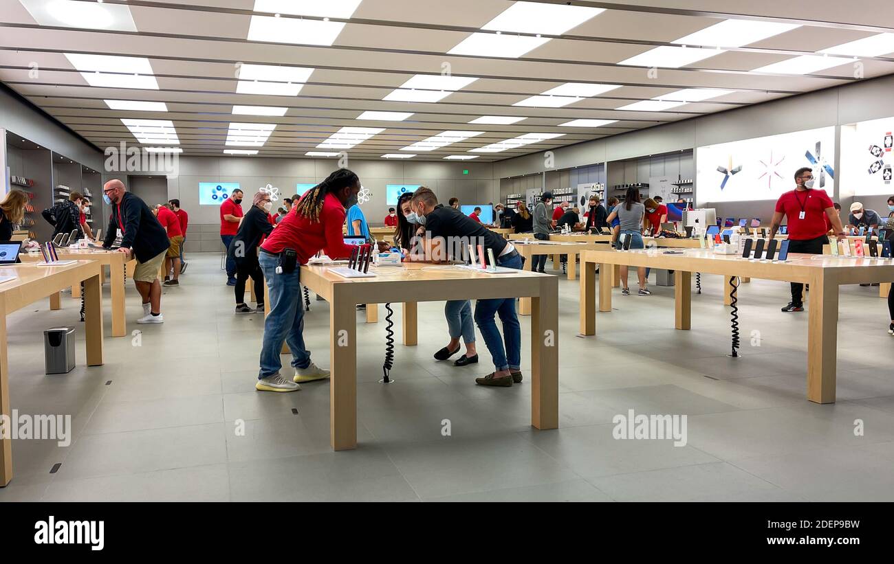 Orlando, FL USA - November 20, 2020: Salespeople and customers at an Apple  store looking at the latest Apple products for sale Stock Photo - Alamy