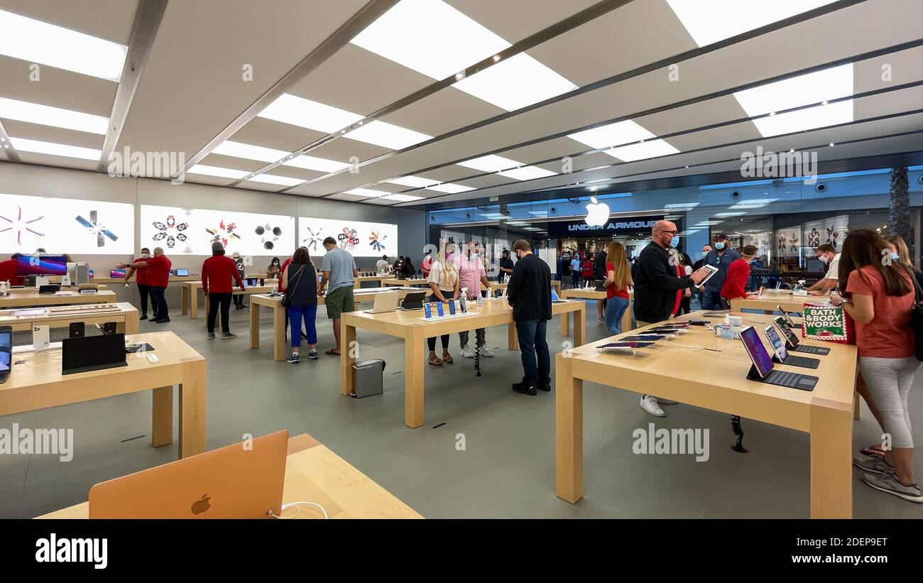 Salespeople and Customers at an Apple Store Looking at the Latest Apple  Products for Sale Editorial Stock Photo - Image of american, international:  203627338