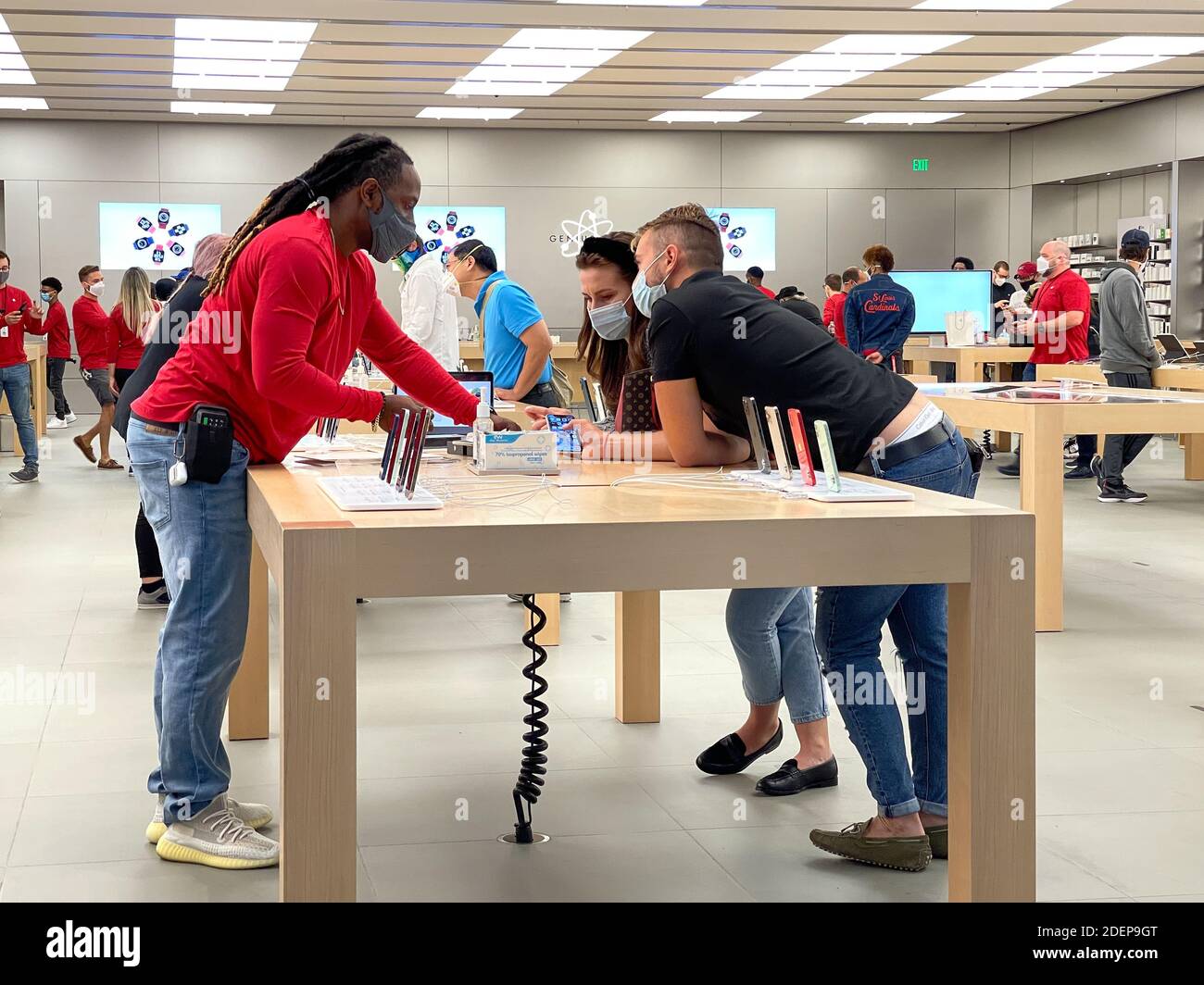 Orlando, FL USA - November 20, 2020: A salesperson and customers at an Apple  store looking at the latest Apple iPhone 12 models for sale Stock Photo -  Alamy