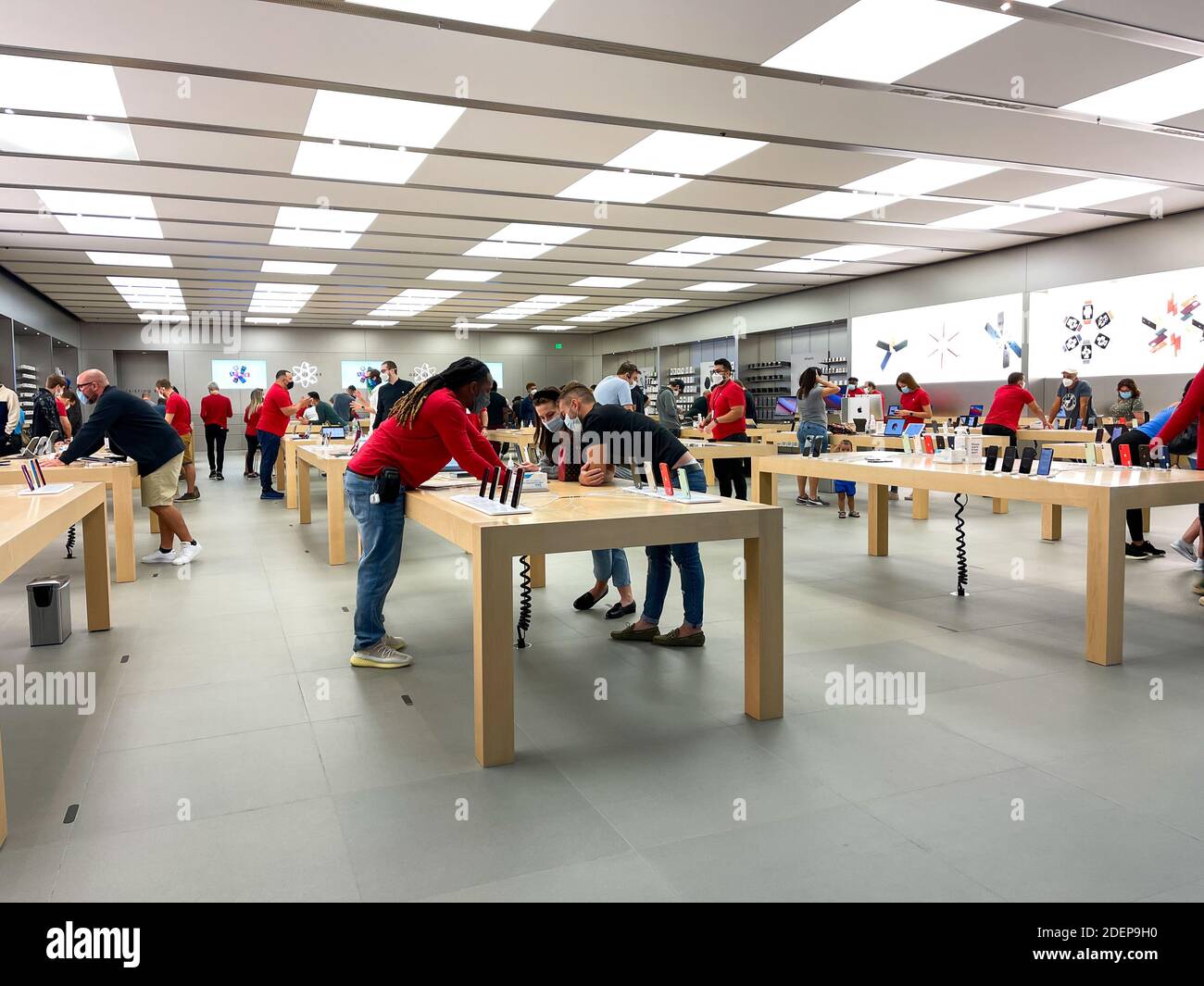 Orlando, FL/USA - 10/25/20: People waiting in line at the Apple retail store  to look at and possibly purchase the new iPhone 12 and 12 Pro smartphones  Stock Photo - Alamy