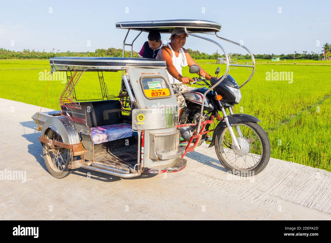 A custom built tricycle, a local passenger vehicle in Batangas, Philippines Stock Photo