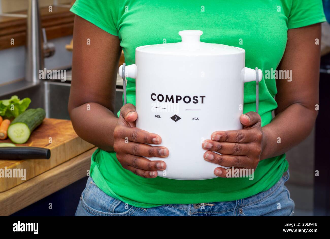 Close up of hands of black African Australian woman holding a kitchen
