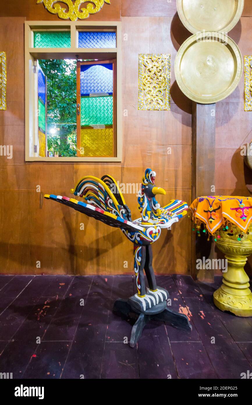 A traditional wood carving of a sarimanok at the Maranao Village at the Bangsamoro Government Center in Cotabato City Stock Photo