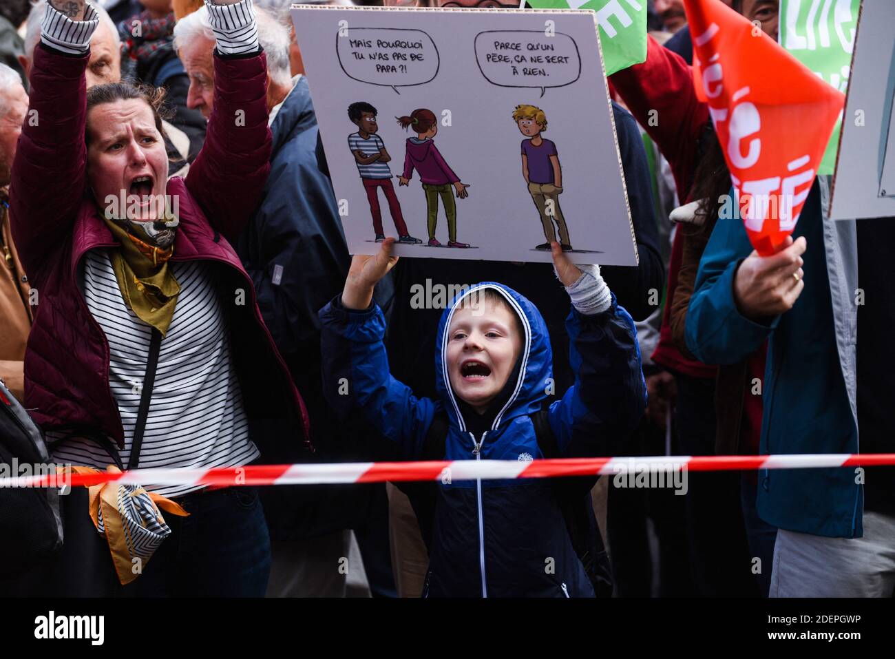 People hold flags as they take part in a Marchons Enfants demonstration against the GPA under the slogan Liberte Egalite Paternite where several tens of thousands of people people (between 75,000 and 600,000) responded to the call of the Manif Pour Tous movement to participate in Paris in the major mobilization entitled Marchons Enfants in order to protest against the Bioethics law legalizing PMA (medically assisted procreation) to homosexual couples. Paris, France, October 6, 2019. Photo by Julie Sebadelha/ABACAPRESS.COM Stock Photo