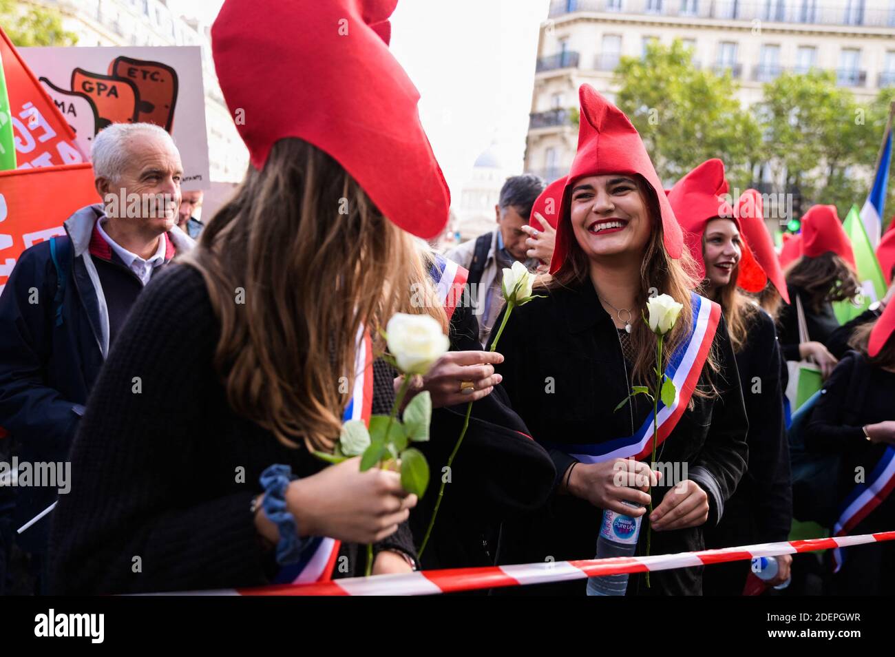 People hold flags as they take part in a Marchons Enfants demonstration against the GPA under the slogan Liberte Egalite Paternite where several tens of thousands of people people (between 75,000 and 600,000) responded to the call of the Manif Pour Tous movement to participate in Paris in the major mobilization entitled Marchons Enfants in order to protest against the Bioethics law legalizing PMA (medically assisted procreation) to homosexual couples. Paris, France, October 6, 2019. Photo by Julie Sebadelha/ABACAPRESS.COM Stock Photo