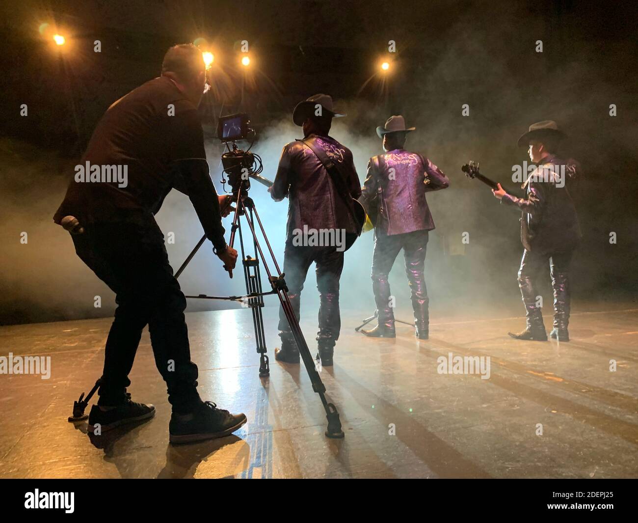 Sierreño Genre Example Musical production, recording of music video clip of a group from the ...