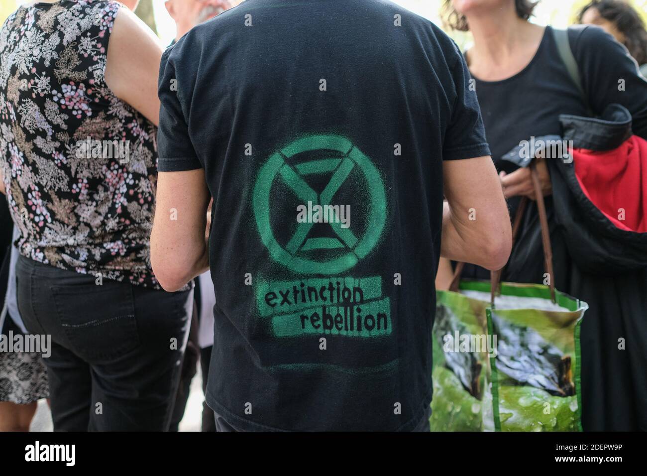 XR logo on tee-shirt. Members of 'Extinction Rebellion' (XR) performed a die-in in Toulouse, south western France, October 13, 2019. The museum hosting an exhibition entitled 'Extinction, the end of a world?', the activists - known for their shock actions - wished to focus public attention to the climate emergency. Photo by Patrick Batard/ABACAPRESS.COM Stock Photo