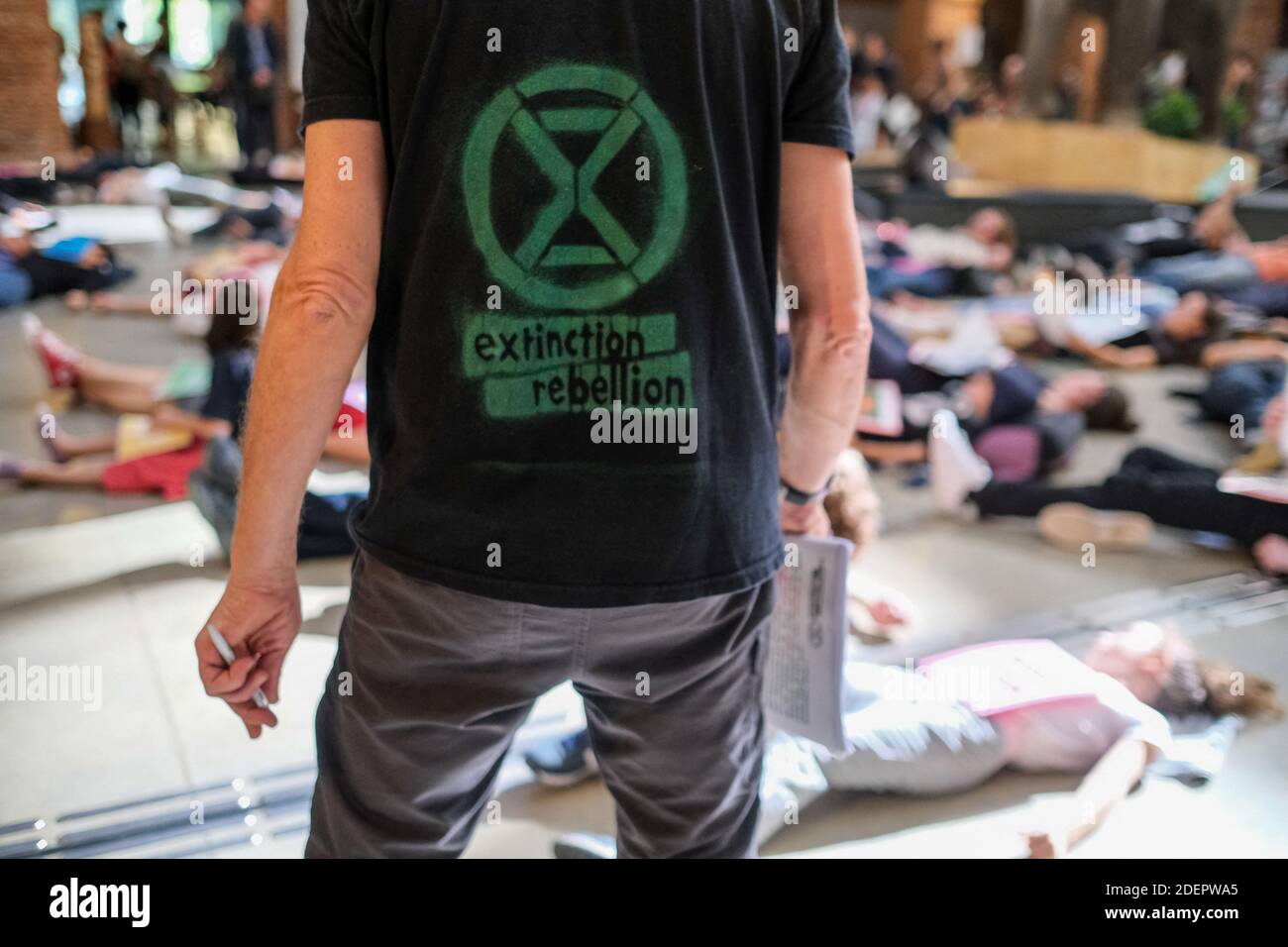 XR logo on tee-shirt. Members of 'Extinction Rebellion' (XR) performed a die-in in Toulouse, south western France, October 13, 2019. The museum hosting an exhibition entitled 'Extinction, the end of a world?', the activists - known for their shock actions - wished to focus public attention to the climate emergency. Photo by Patrick Batard/ABACAPRESS.COM Stock Photo