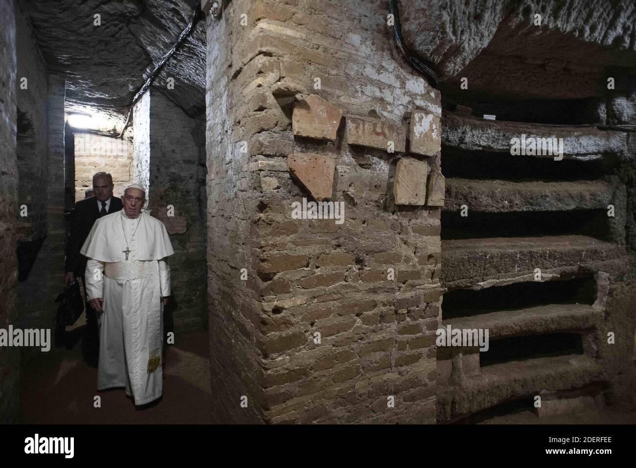 For the celebration of the feast of all the dead Pope Francis Celebrates Mass in the Catacombs of Priscilla in Rome, Italy on November 2, 2019. It was the first time in his life that pope Francis visits a catacomb. The catacombs were used for early Christians burials from the late 2nd-4th Century. The labyrinthine cemetery complex stretching for 13 kilometers over several levels underneath northern Rome is known as the 'Queen of the catacombs' because it features burial chambers of popes and a tiny, delicate fresco of the Madonna nursing Jesus dating from around 230-240 A.D. Photo by ABACAPRES Stock Photo