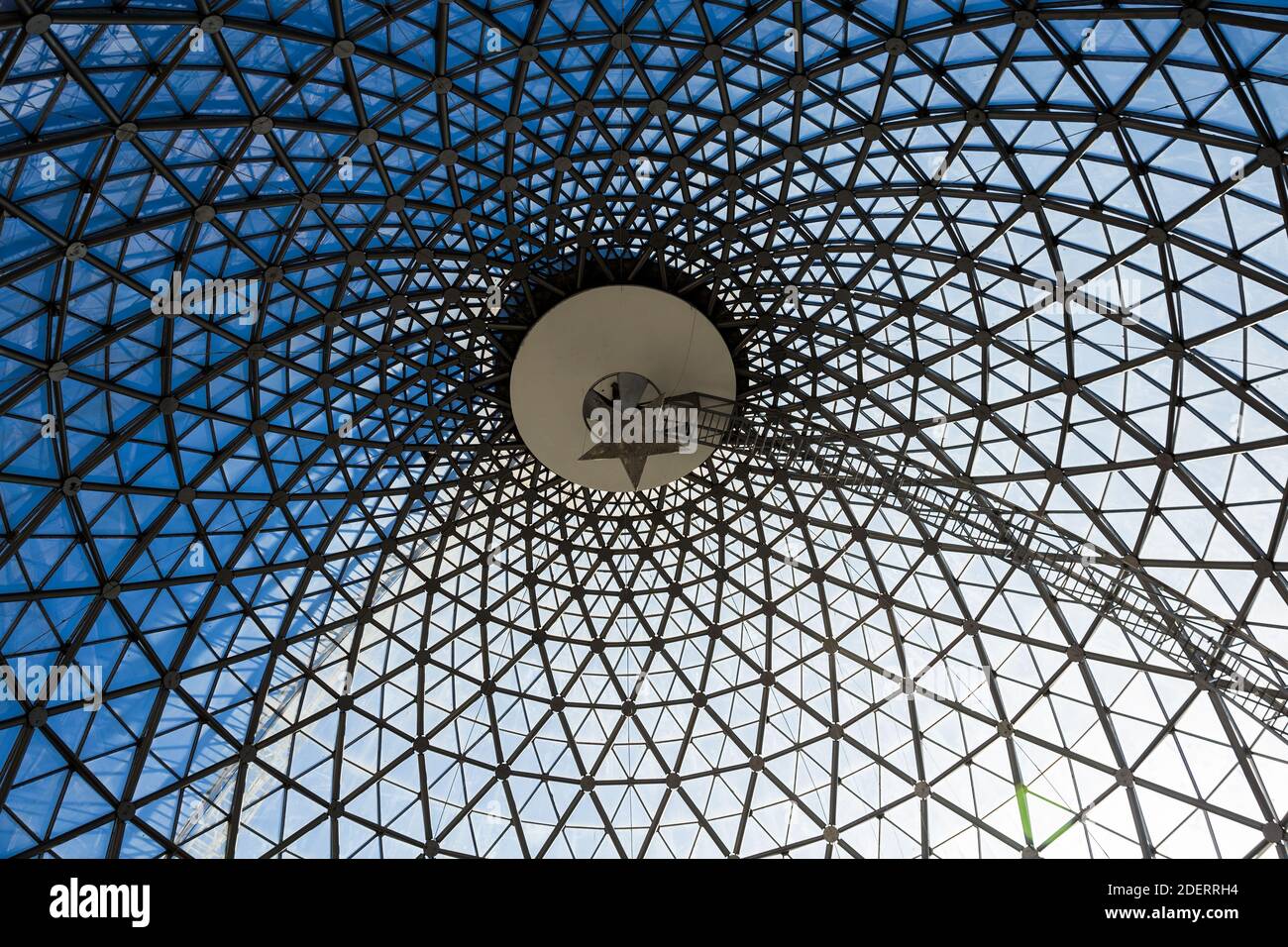 Architecturally lattice geometric steel construction roof.From below to