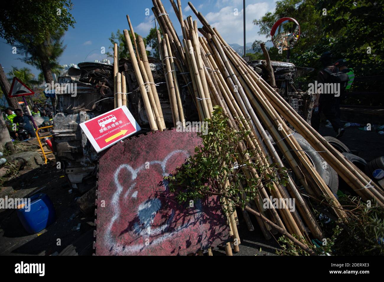 Bamboo sticks, lawn mower, spray paint Winnie the Pooh and other objects are use to make shift