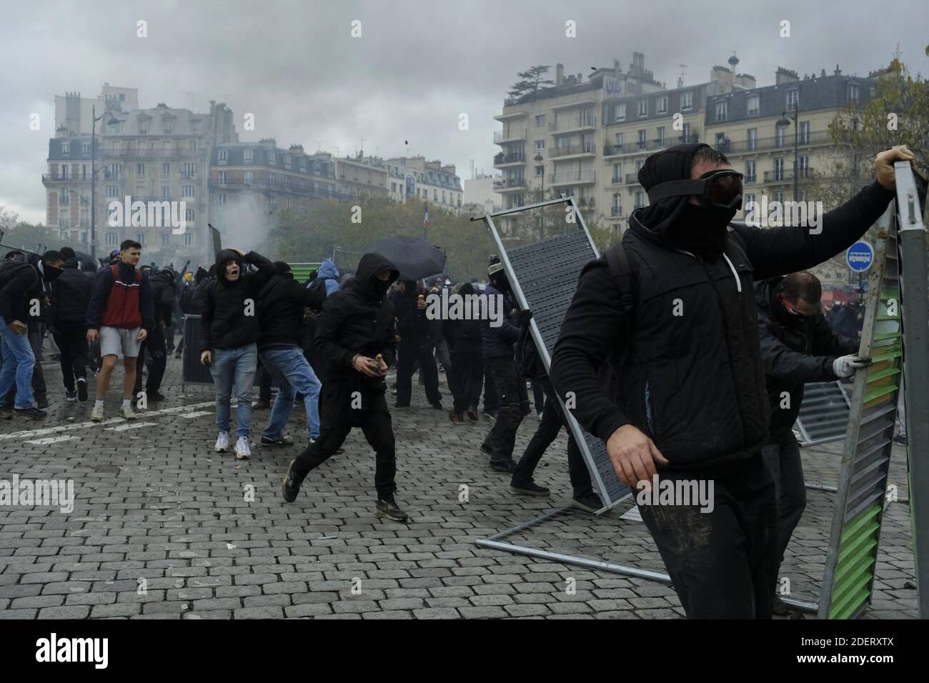 Gilets Jaunes or yellow vest and Black Bloc protestors clash with French  riot police during a demonstration marking the first anniversary of the  "yellow vest" (gilets jaunes) movement. French "yellow vest" protesters
