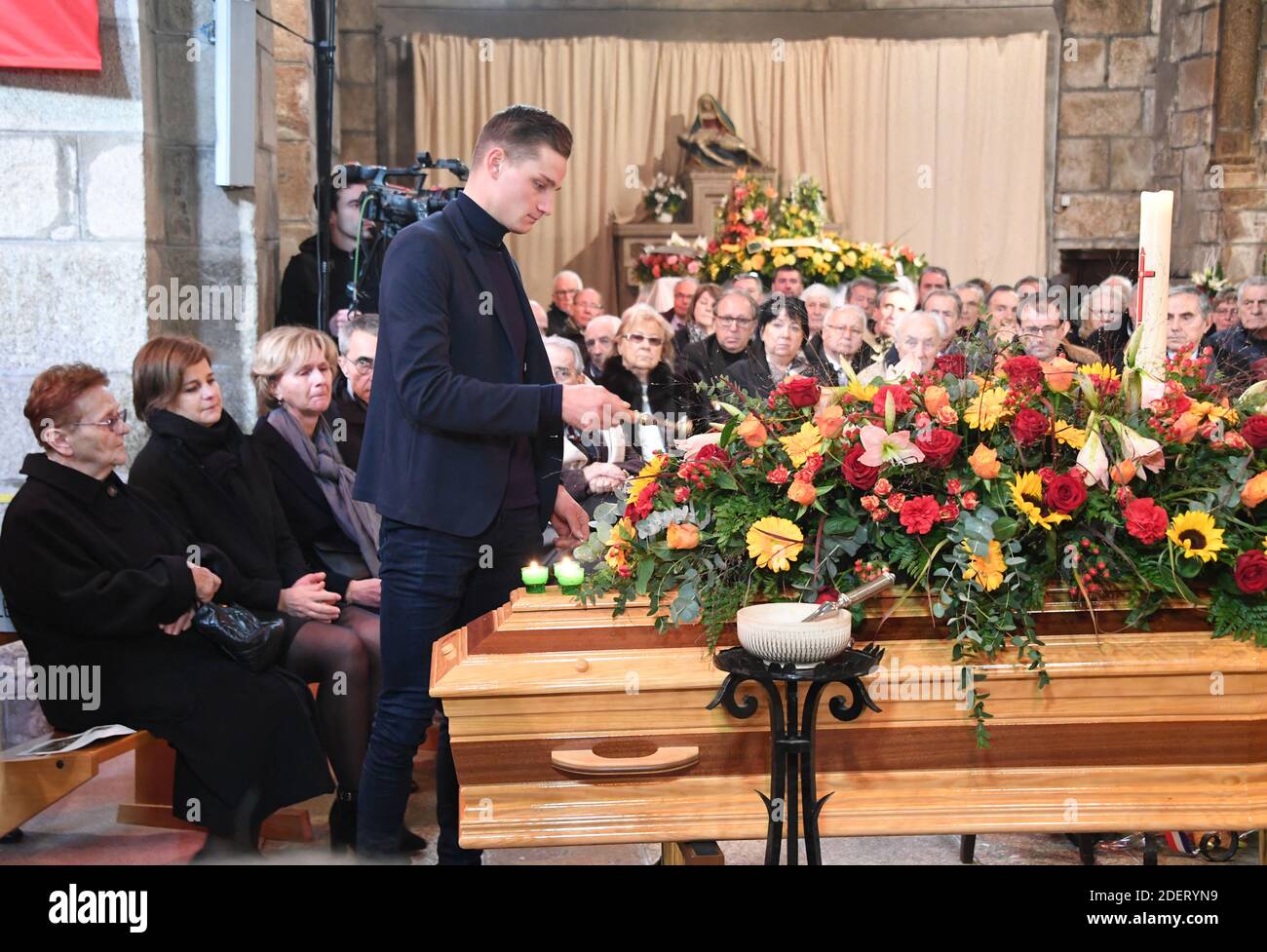 Late cyclist Raymond Poulidor's grandson Dutch cyclist Mathieu van der Poel  (up) his widow Gisele Poulidor (L) and his daughter Corinne Poulidor (2L)  attend the funerals of the French champion Raymond Poulidor