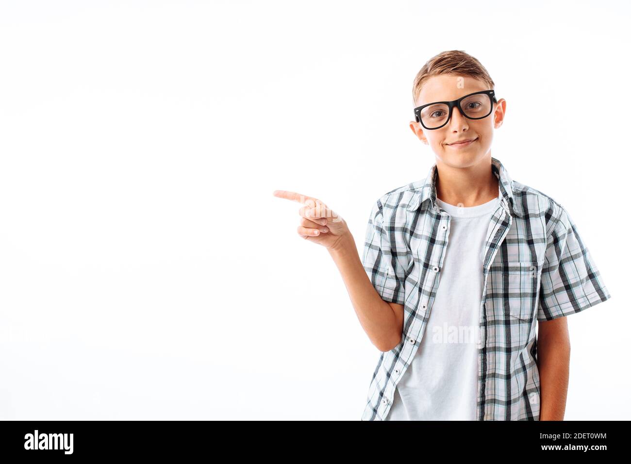 man pointing at copy blank space, handsome young guy in Studio on white ...
