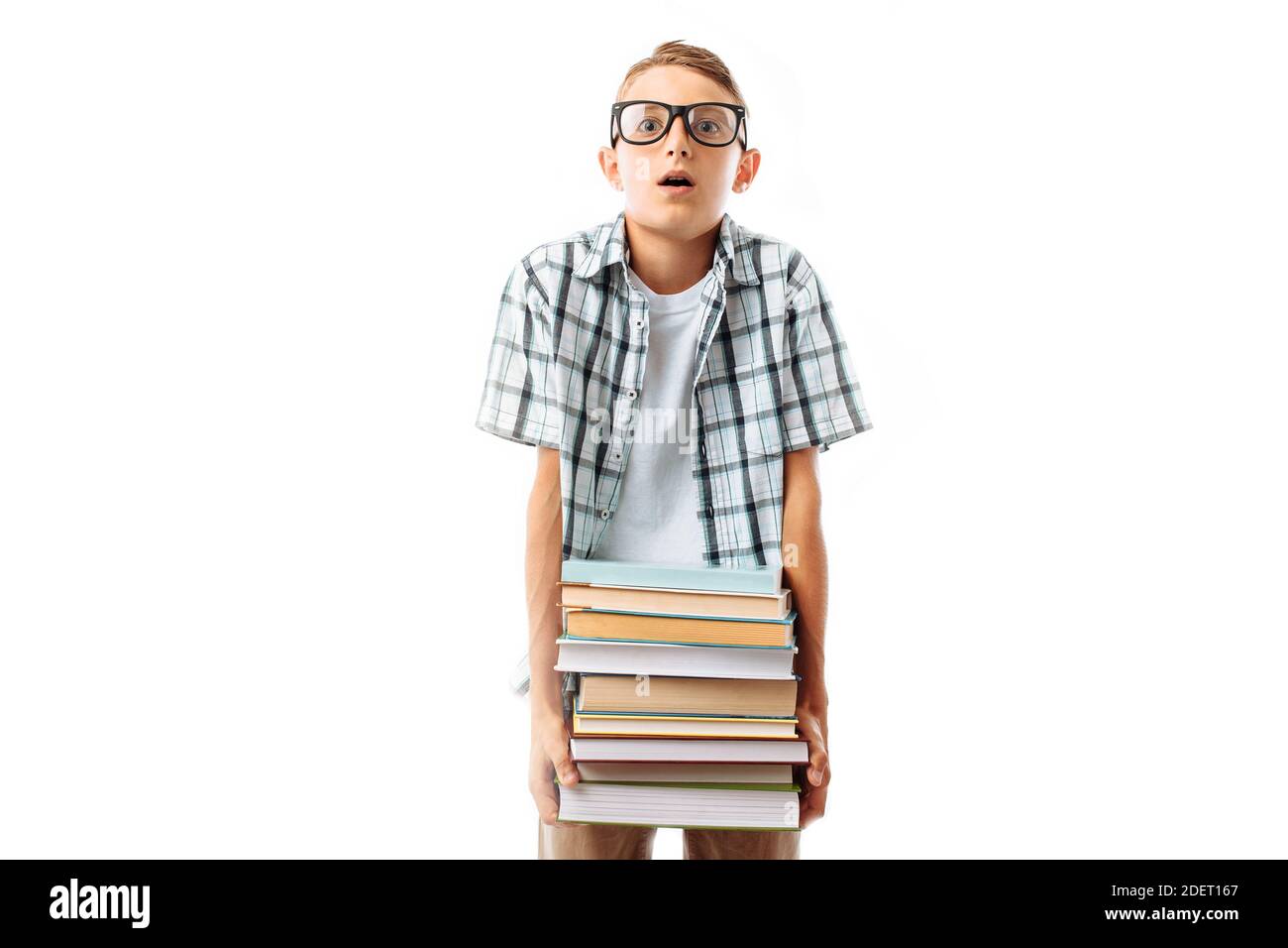 Beautiful student holding a stack of books, botany glasses hard to keep a large stack of books in the Studio Stock Photo