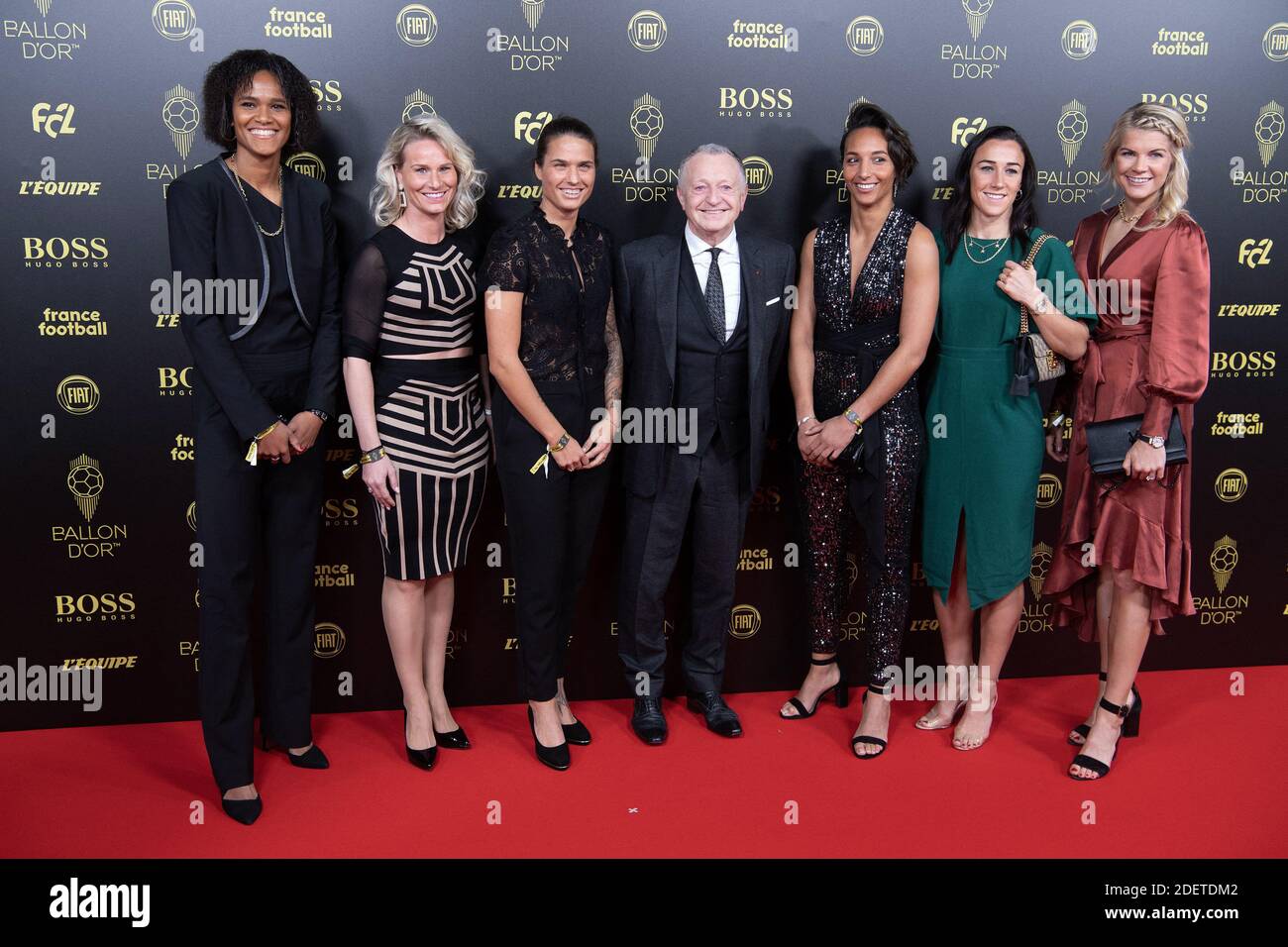 Olympique Lyon players (L-R) Wendie Renard, Amandine Henry, Dzsenifer  Marozsan, President of Olympique Lyon Jean-Michel Aulas, Sarah Bouhaddi,  Lucy Bronze, and Ada Hegerberg arrive to attend the Ballon d Or France  Football