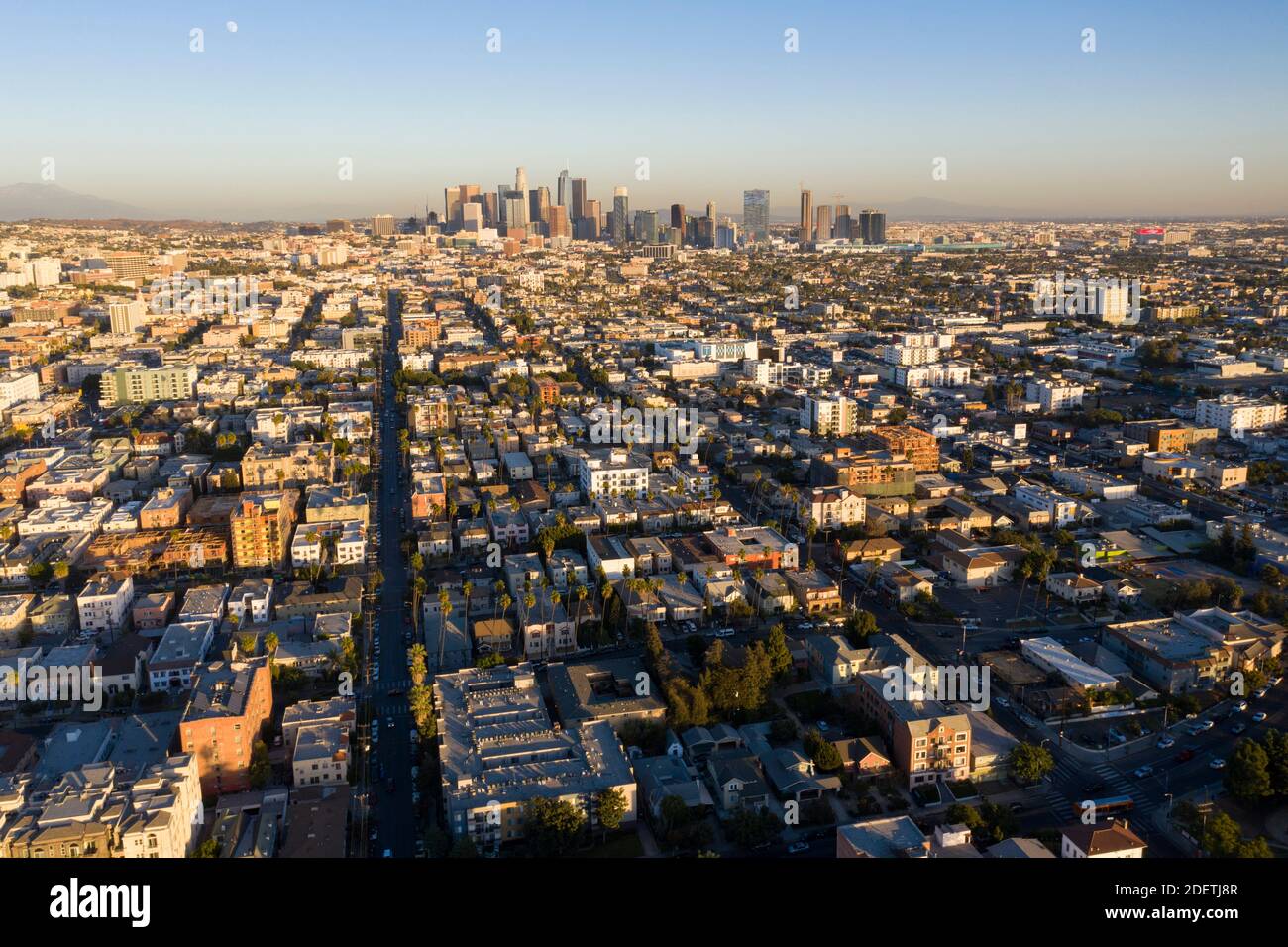 Aerial view of Central Los Angeles from the air, with sprawling skyline and moon rising Stock Photo