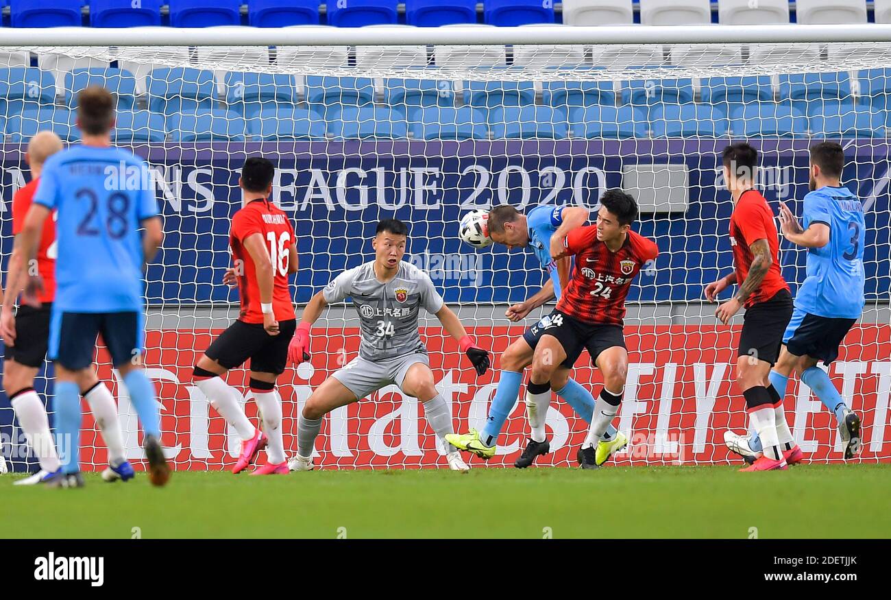 Doha, Qatar. 1st Dec, 2020. Alex Wilkinson (4th R) of Sydney FC heads the ball to score the opening goal during a Group H football match of the AFC Champions League between Shanghai SIPG FC of China and Sydney FC of Australia in Doha, Qatar, Dec. 1, 2020. Credit: Nikku/Xinhua/Alamy Live News Stock Photo