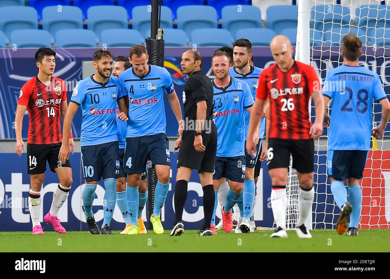 Doha, Qatar. 1st Dec, 2020. Alex Wilkinson (3rd L) of Sydney FC celebrates with teammates after scoring during a Group H football match of the AFC Champions League between Shanghai SIPG FC of China and Sydney FC of Australia in Doha, Qatar, Dec. 1, 2020. Credit: Nikku/Xinhua/Alamy Live News Stock Photo