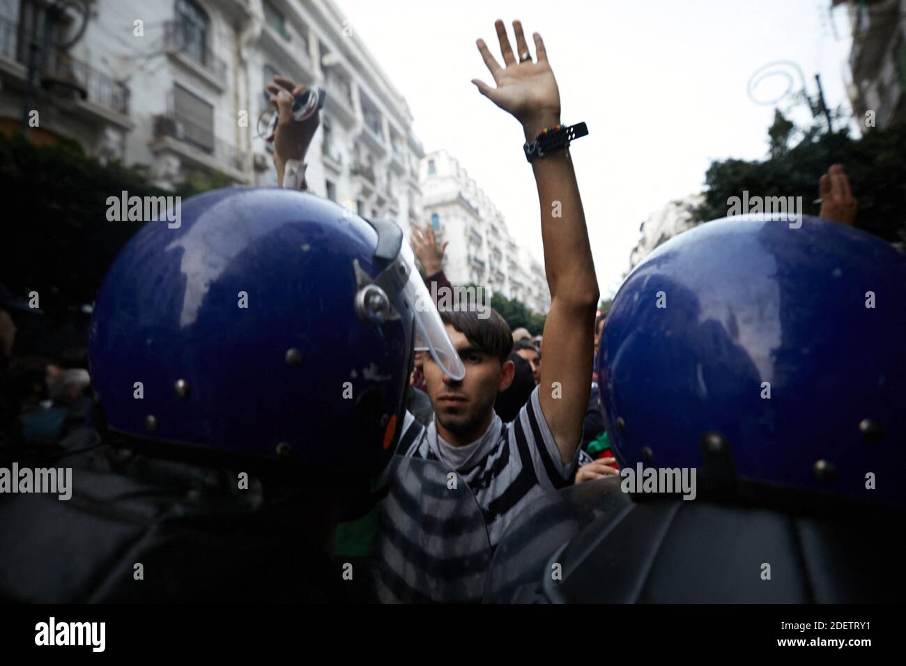 Algerian protesters take part in an anti-government demonstration in the capital Algiers on December 12, 2019 during the presidential election. Five candidates are running in Algeria's presidential election to replace ousted Algerian president Abdelaziz Bouteflika, the country's election authority said Saturday, amid widespread protests against the vote. Former premiers Ali Benflis and Abdelmadjid Tebboune are considered front-runners in an election opposed by the mass protest movement that alongside the army forced Bouteflika to resign in April after 20 years in power.No opinion polls have be Stock Photo