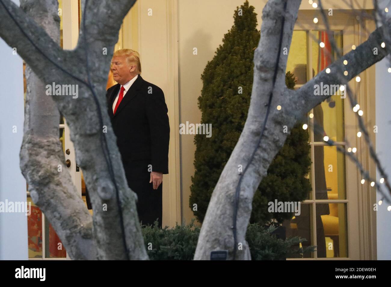 U.S. President Donald Trump walks out from the Oval Office of the White ...