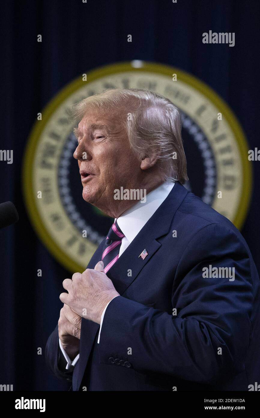 US President Donald J. Trump delivers remarks in front of the seal of ...
