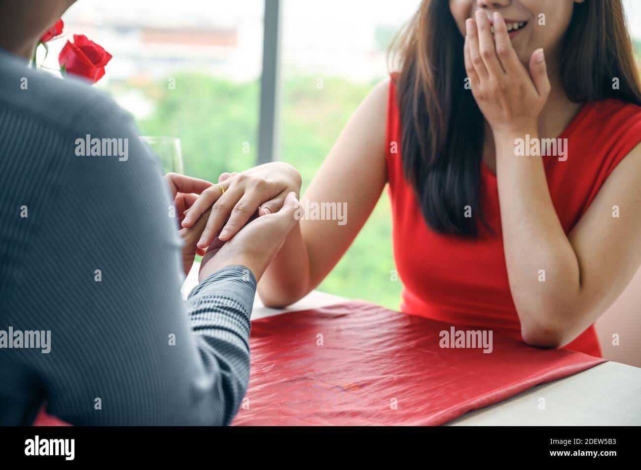 Close up of engaged couple with diamond ring. Wedding and relationships concept Stock Photo