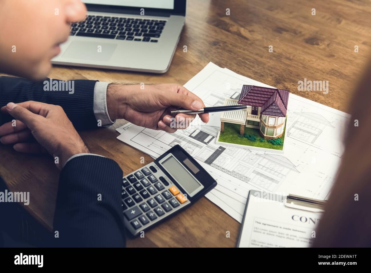 Housing developer agent explaining concept to client or architect for