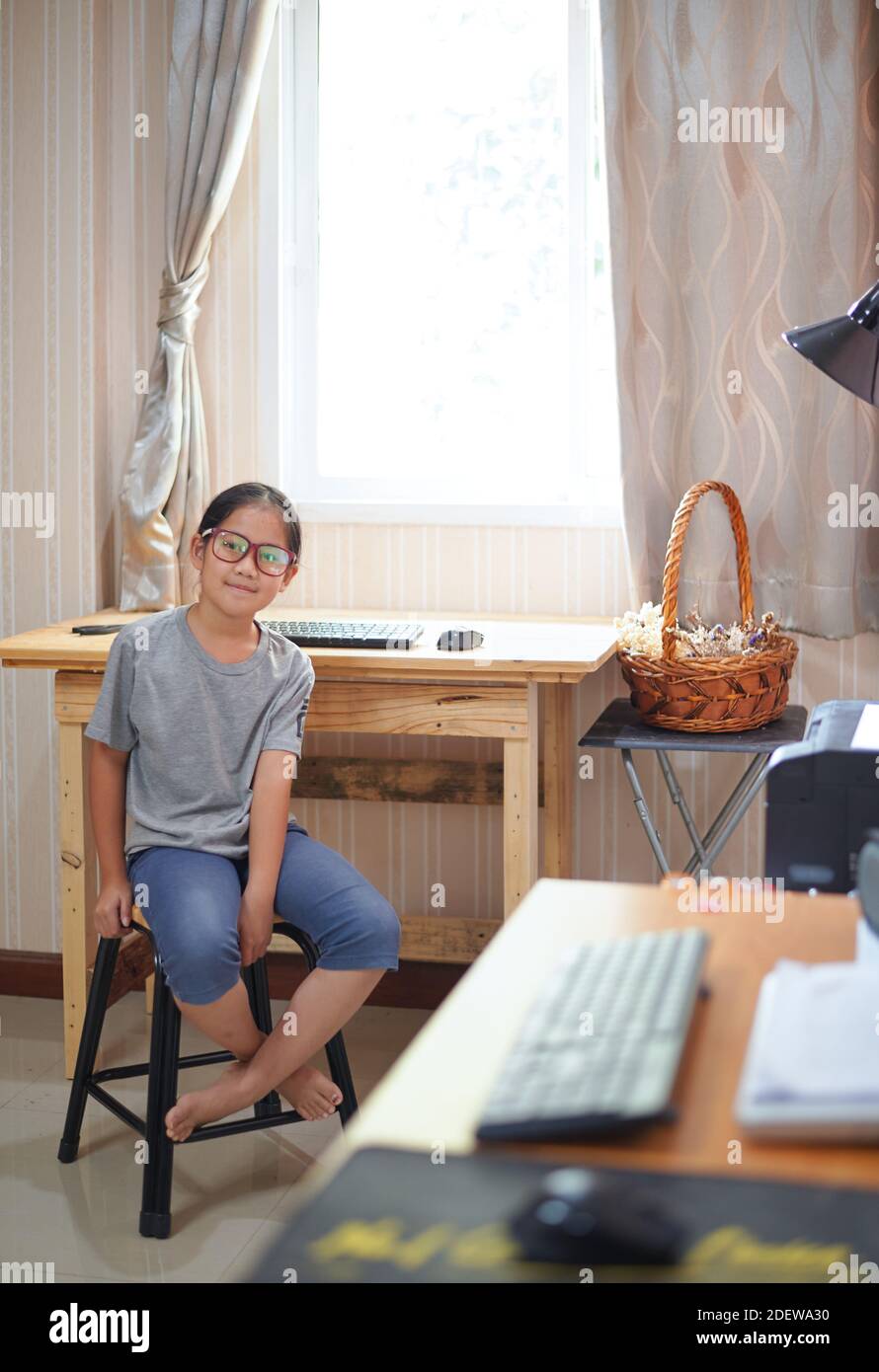Preteen girl sitting in chair hi-res stock photography and images - Alamy