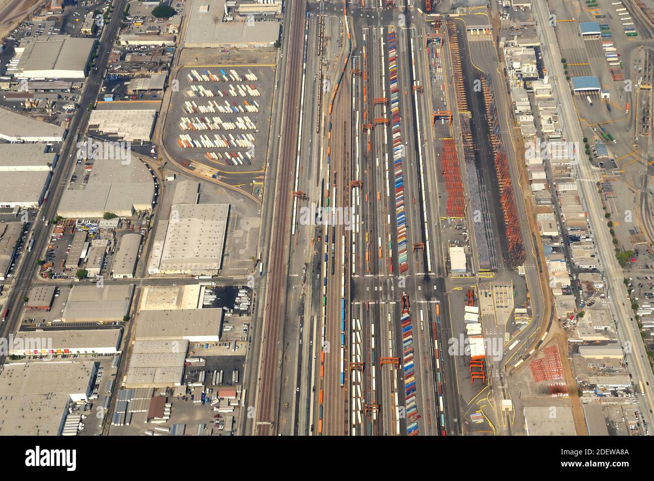 BNSF Railway Company intermodal cargo operations at Los Angeles, USA. Aerial view of freight transportation facility with multiple containers. Stock Photo
