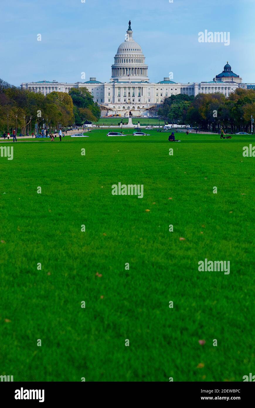 Washington, D.C. - November 3, 2020: Tourists enjoy an autumn afternoon on the National Mall with the United States Capitol building in the background. Stock Photo