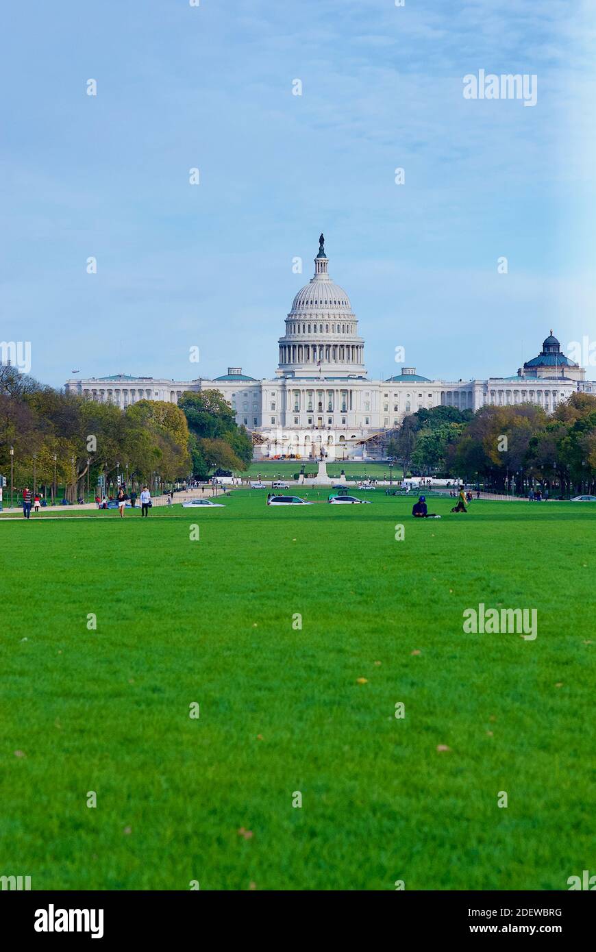 Washington, D.C. - November 3, 2020: Tourists enjoy an autumn afternoon on the National Mall with the United States Capitol building in the background. Stock Photo