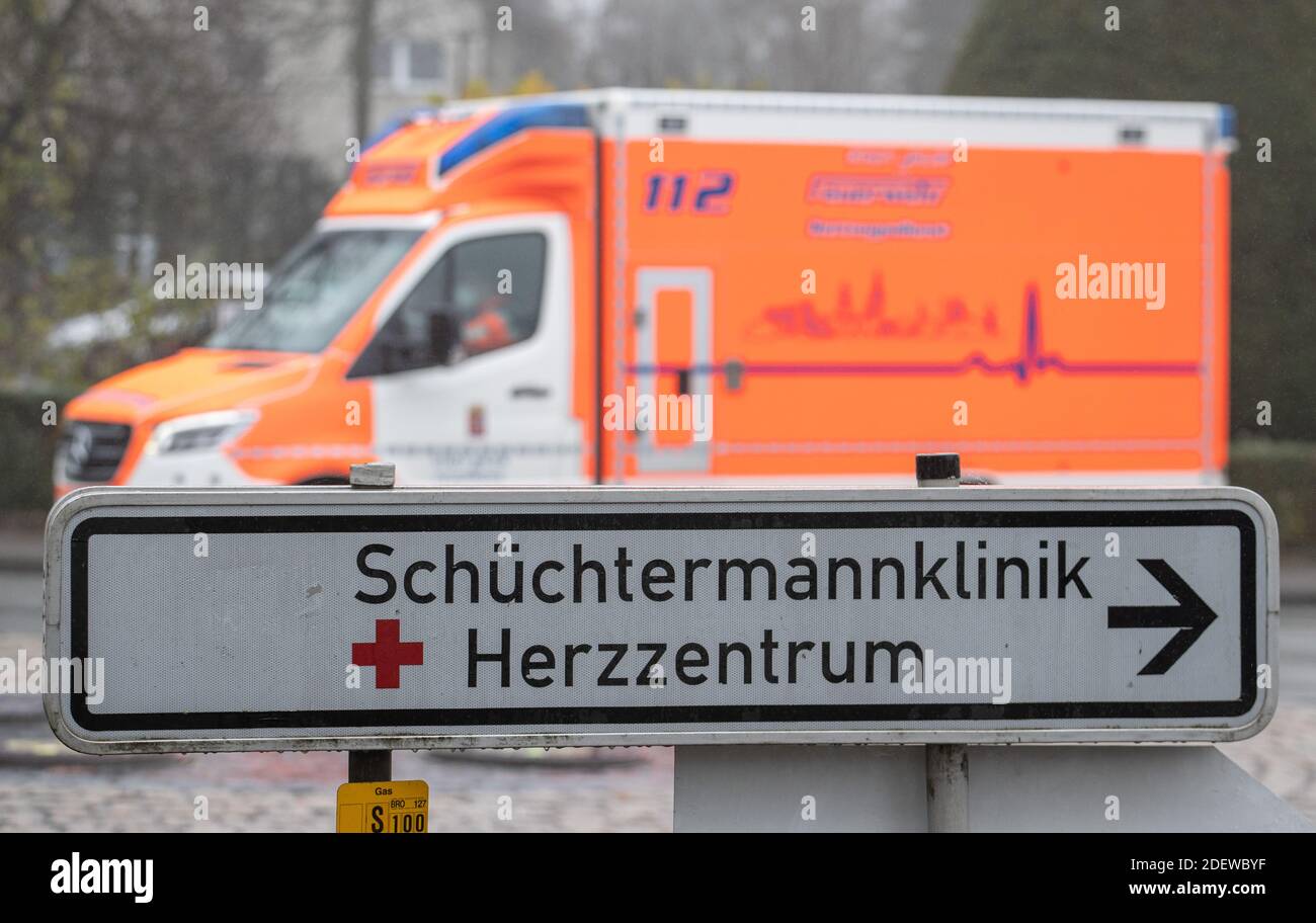 Bad Rothenfelde, Germany. 01st Dec, 2020. An ambulance drives past a sign 'Schüchtermannklinik Herzzentrum'. The approximately 40 spa and health resorts in Lower Saxony suffer from the effects of the corona pandemic. Credit: Friso Gentsch/dpa/Alamy Live News Stock Photo