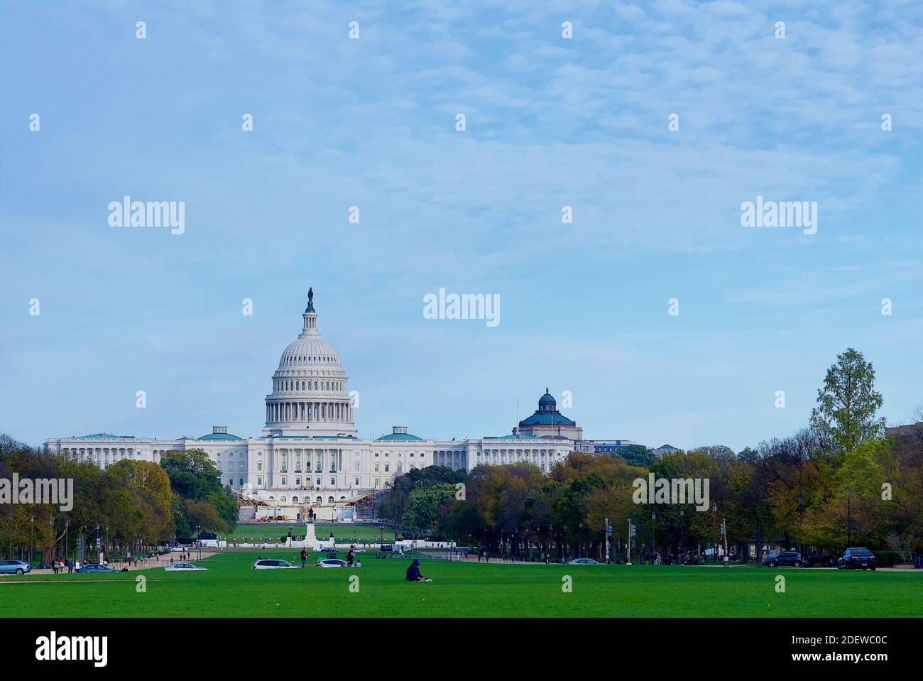Washington, D.C. - November 3, 2020: Tourists enjoy an autumn afternoon on the National Mall with the U.S. Capitol building seen in the background. Stock Photo