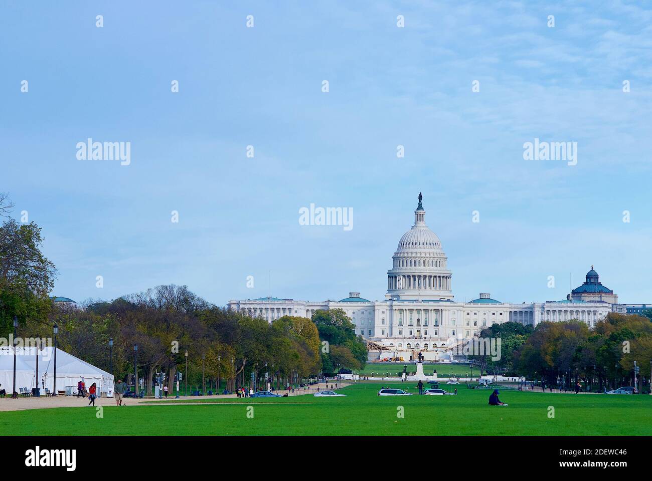 Washington, D.C. - November 3, 2020: Tourists enjoy an autumn afternoon on the National Mall with the U.S. Capitol building seen in the background. Stock Photo