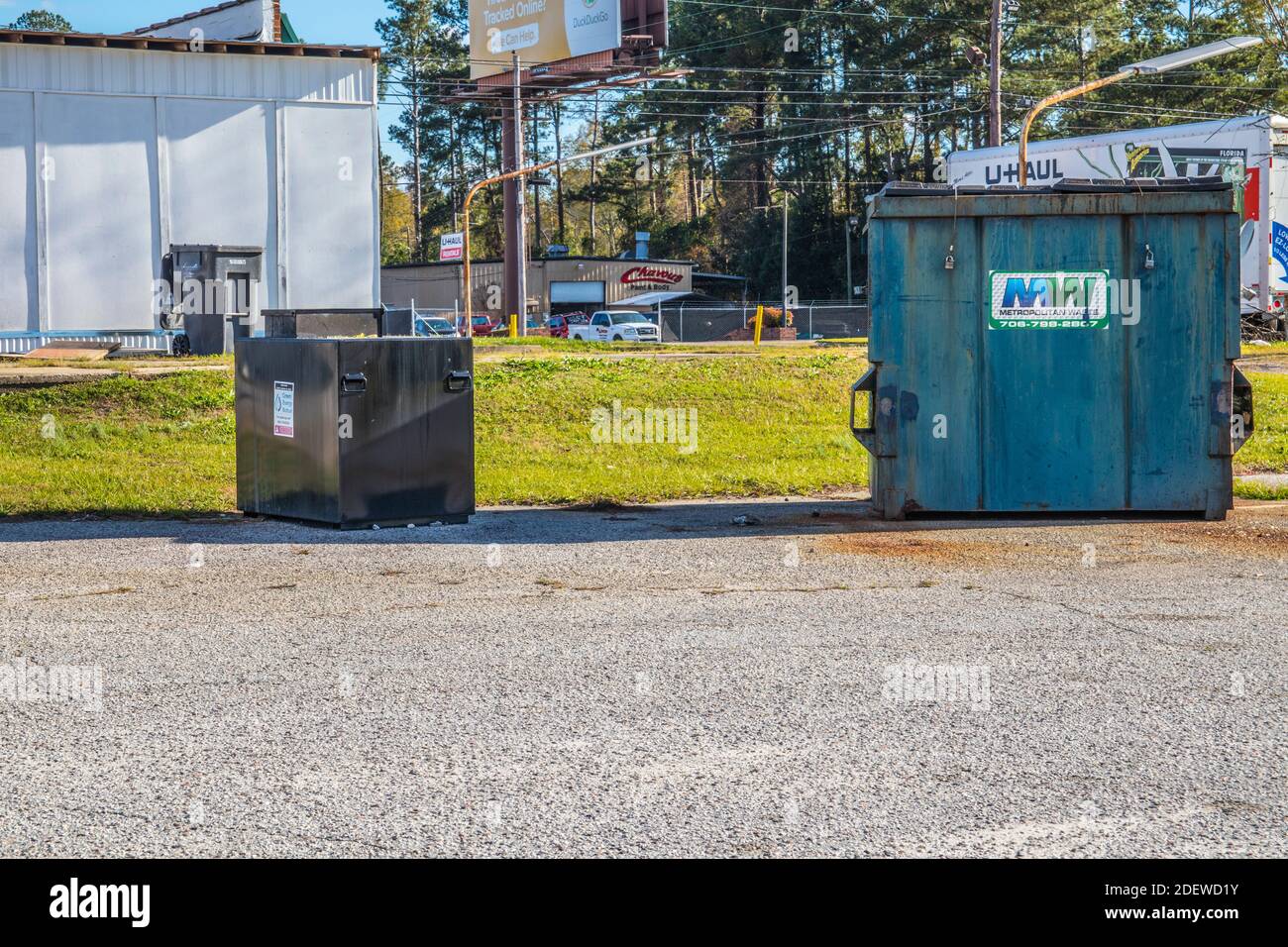 Augusta, Ga USA 12 01 20 Waste dumpster and oil recycling bin Stock