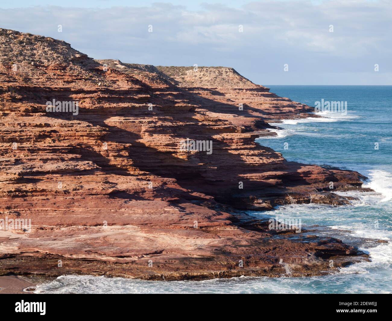 Eroded red sandstone seacliffs above the Indian Ocean, Kalbarri National Park, Western Australia. Stock Photo